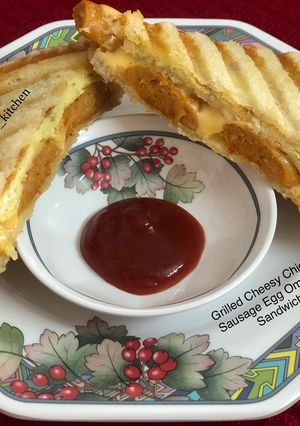 A picture of Grilled Cheesy Chicken Sausage Egg Omelette Sandwich.