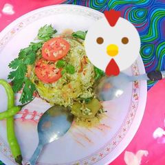 A picture of Aloo biryani with coriandar and mint chutney twist.