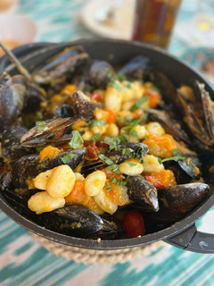 Una foto de Gnocchi con Mejillones y Tomates Cherry