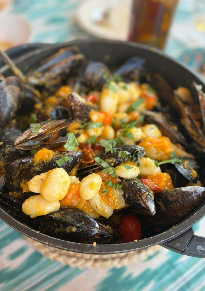 Una foto de Gnocchi con Mejillones y Tomates Cherry