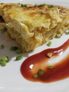 Una foto de Tortilla con papas y zanahoria