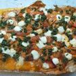 Palometa al horno con pimientos asados y queso feta