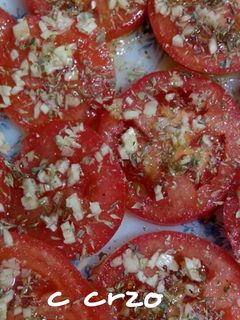 Una foto de Tomate al ajillo
