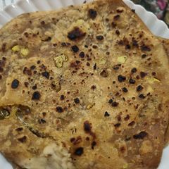 A picture of Garlic Chilli Pickle Paratha.