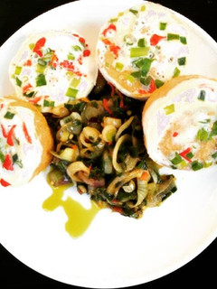 A picture of Moimoi with green pepper and onion sauce.