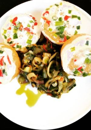 A picture of Moimoi with green pepper and onion sauce.
