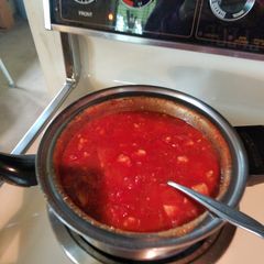 A picture of Chicken and macaroni with "homemade"tomato sauce.