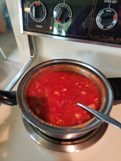 A picture of Chicken and macaroni with "homemade"tomato sauce.