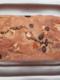 A picture of Whole wheat Banana oats bread with nuts n choco chips.