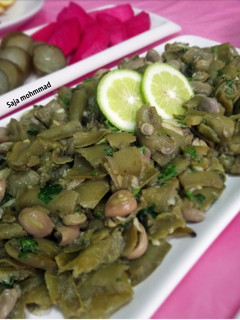 صورة لوصفة فول اخضر بالثوم و الكزبرة