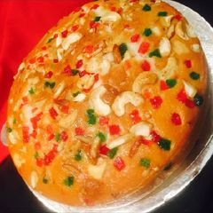 A picture of Orange dry fruits cake.