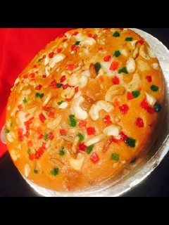 A picture of Orange dry fruits cake.