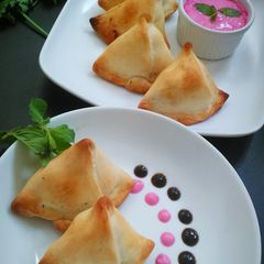A picture of Baked Samosa with Beetroot yoghurt dip.