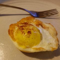 A picture of Air Fryer Baked Sunnyside Up Egg.