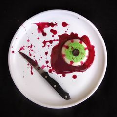 A picture of Halloween Bloody Eye Representing Coconut Milk and Banana Pudding with twist of Beetroot Sauce.