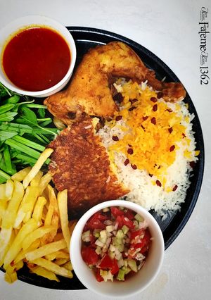 A picture of Zereshk Polo ba Morgh (Persian Barberry Rice with Chicken).