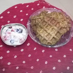 A picture of Nutri Waffles with fruity yoghurt.