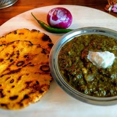 A picture of Punjabi Pind (Village) Style ~ Sarson ka saag aur Makki ki Roti.