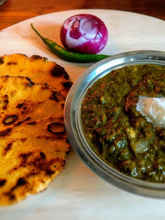 A picture of Punjabi Pind (Village) Style ~ Sarson ka saag aur Makki ki Roti.
