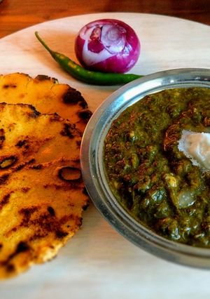 A picture of Punjabi Pind (Village) Style ~ Sarson ka saag aur Makki ki Roti.