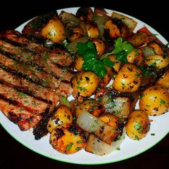 A picture of Mike's Grilled Pork Chops & Baby Golden Russets.
