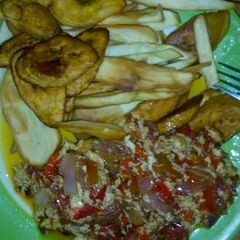 A picture of Fried chips and omelette..
