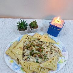 A picture of Chicken cheese pasta with garlic bread.
