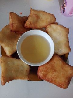 Una foto de Tortas fritas con almíbar