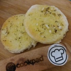 A picture of Herbed bread with cream of spinach soup.