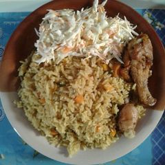 A picture of Fried rice with chicken.