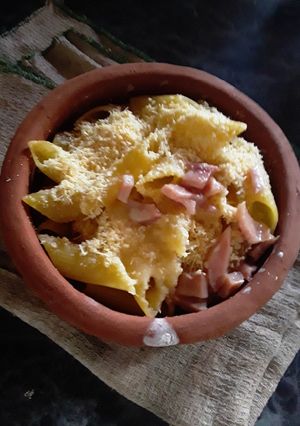 Una foto de Fideos gratinados con crema y jamón