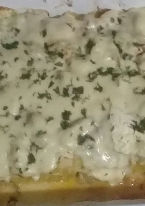 Una foto de Lasaña de pollo en salsa de hierbas
