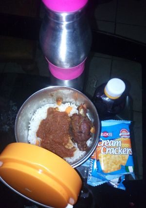 A picture of White rice and stew with fried chicken.