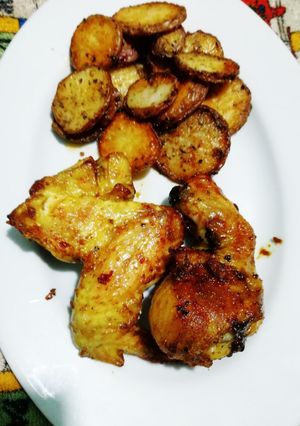 Una foto de Pollo y papas al horno