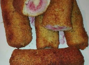 Una foto de Flamenquínes de pan de molde con beicon longaniza fresca y queso chedar
