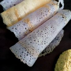 A picture of Blue paper dosa. (Made from natural flowers butterfly pea flower dosa).