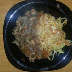 A picture of Matumbo with fried cabbage.