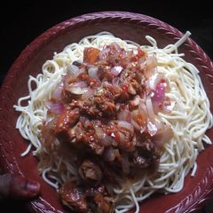 A picture of White spaghetti with stew.