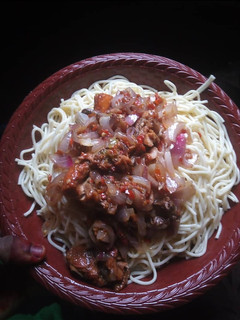 A picture of White spaghetti with stew.