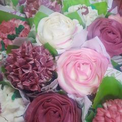 A picture of Strawberry frosted cupcakes.