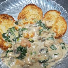 A picture of Blackened chicken and shrimp fondue.