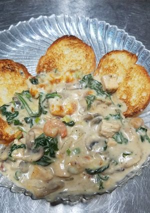 A picture of Blackened chicken and shrimp fondue.