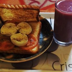 Boiled Egg Sandwich With Pomegranate Juice A picture of Boiled Egg Sandwich With Pomegranate Juice.
