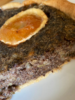 Una foto de Quiche de morcilla y cebolla