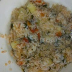 A picture of Fried rice with spinach.