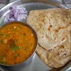 A picture of Pithla with parathas.