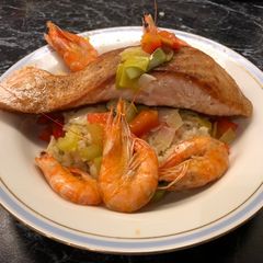 A picture of Salmon Risotto with Prawns.