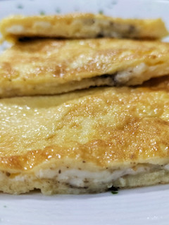 Una foto de Tortilla de queso trufada