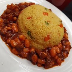A picture of Couscous and baked beans sauce.