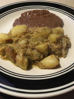 Una foto de Carnitas de cerdo con papas